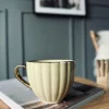VIAMAJA Krus, Kopper Og Glas|Porcelæn Og Stentøj<Tekop med guld hank – Gul